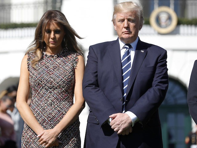 President Donald Trump and first lady Melania Trump stand during a moment of silence to remember the victims of the mass shooting in Las Vegas, on the South Lawn of the White House in Washington, Monday, Oct. 2, 2017. (AP Photo/Pablo Martinez Monsivais)