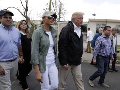 President Donald Trump and first lady Melania Trump arrive at Luis Muniz Air National Guar