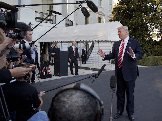 President Donald Trump speaks to reporters before leaving the White House in Washington, S