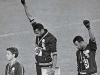 Black-power-salute-1968-Olympics-ap John Carlos (on right), Tommie Smith (centre) and Peter Norman, who wore an Olympic Project for Human Rights badge in support of their gesture. When Norman died in 2006, Carlos and Smith were pallbearers at his funeral. Photograph: AP