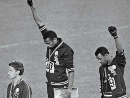 John Carlos (on right), Tommie Smith (centre) and Peter Norman, who wore an Olympic Project for Human Rights badge in support of their gesture. When Norman died in 2006, Carlos and Smith were pallbearers at his funeral. Photograph: AP