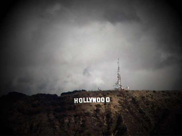 Clouds are shown over the iconic Hollywood sign Thursday Feb. 27, 2014 in Los Angeles. Southern California got an overnight soaking Thursday as residents prepared for a second, more powerful storm that could bring heavier rain and prompted fears of mudslides in communities along fire-scarred foothills. (AP Photo/Nick Ut)