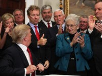 Donald-Trump-Rand-Paul-Obamacare-Reform-Oct-12-2017-Getty WASHINGTON, DC - OCTOBER 12: U.S. Sen. Rand Paul (R-KY) shows a thumbs up to President Donald Trump during an executive order signing as Vice President Mike Pence, Rep. Virginia Foxx (R-NC) and Secretary of Labor Alexander Acosta look on during an event in the Roosevelt Room of the White …