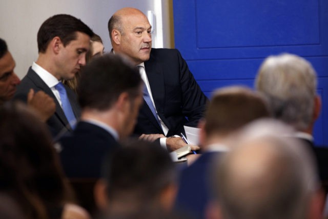 White House chief economic adviser Gary Cohn listens as White House press secretary Sarah