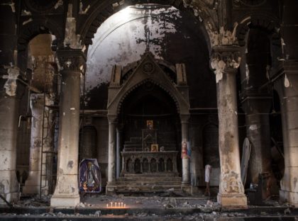 QARAQOSH, IRAQ - NOVEMBER 08: The burnt and destroyed interior of the St Mary al-Tahira church is seen on November 8, 2016 in Qaraqosh, Iraq. The NPU is a military organization made up of Assyrian Christians and was formed in late 2014 to defend against ISIL. Qaraqosh, a largely Assyrian …