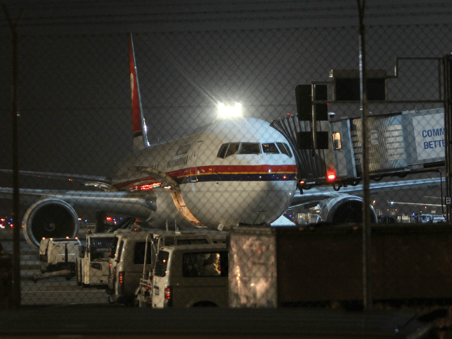 An airplane of Meridiana airline, chartered to deport refugees back to Afghanistan waits t