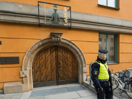 Policemen secure the entrance to the Stockholm District Court where Uzbek national Rakhmat
