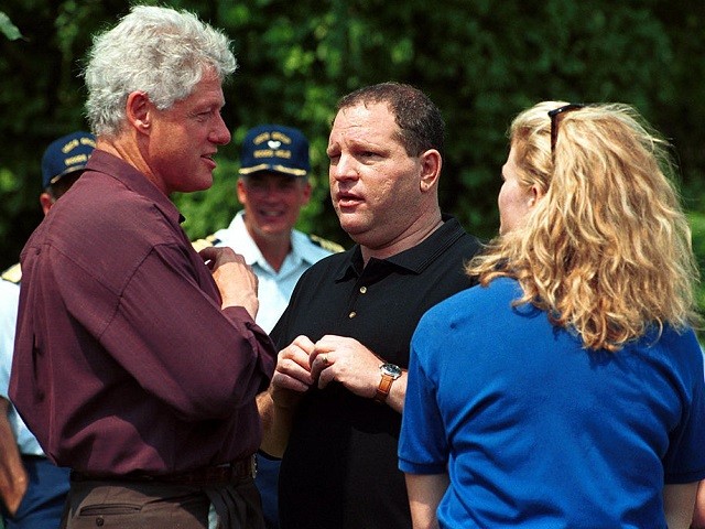 U.S. President Bill Clinton chats with movie executive Harvey Weinstein at the U.S. Coast Guard Station West Chop in Martha's Vineyard, MA August 7, 2000. Clinton ended a four day working vacation which included a party at the home of Weinsteins. (Photo by Darren McCollester/Newsmakers)