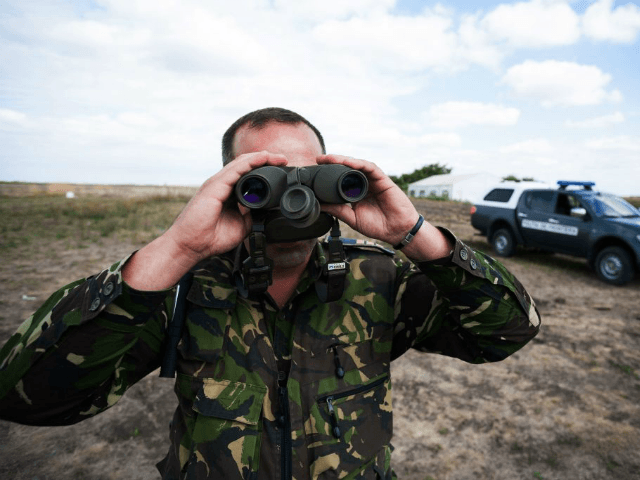 A policemen checks the border area at Triplex Confinium, where the borders of Romania, Hun