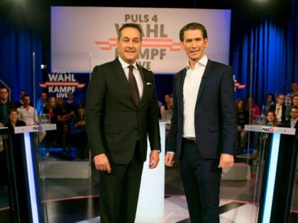 Austria's Minister for Foreign Affairs and chairman of Austrian People's Party (OeVP), Sebastian Kurz (R) and Chairman of the Freedom Party of Austria (FPOe), Heinz-Christian Strache arrive on the set of Austrian Puls 4 private television station before a campaign televised debate on October 8, 2017 in Vienna. / AFP …