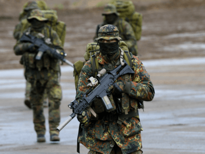 Soldiers of a ranger unit of the German armed forces Bundeswehr explore an area during the informative educational practice 'Land Operation Exercise 2017' at the military training area in Munster, northern Germany, on October 13, 2017. / AFP PHOTO / PATRIK STOLLARZ (Photo credit should read PATRIK STOLLARZ/AFP/Getty Images)