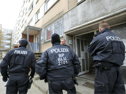 Policemen stand in front of a house at the Neu Zippendorf district in Schwerin, northeastern Germany, where a 19-year-old Syrian man suspected of planning an Islamist bomb attack was arrested on October 31, 2017. The man, identified only as Yamen A, was held at dawn by special forces, suspected of …