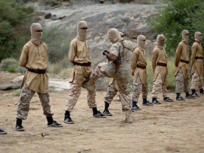 An image from an ISIS propaganda video shows ISIS recruits being kicked in the genitals at a terrorist training camp in Yemen.