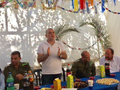 ODED REVIVI, CHIEF FOREIGN ENVOY OF THE YESHA COUNCIL ANS MAYOR OF EFRAT ADDRESSING ISRAELIS AND PALESTINIANS IN HIS SUCCAH