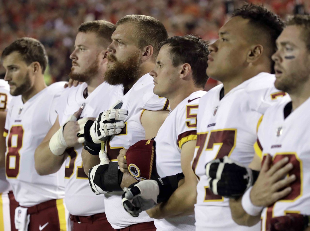 Redskins stand for anthem (Charlie Riedel / Associated Press)