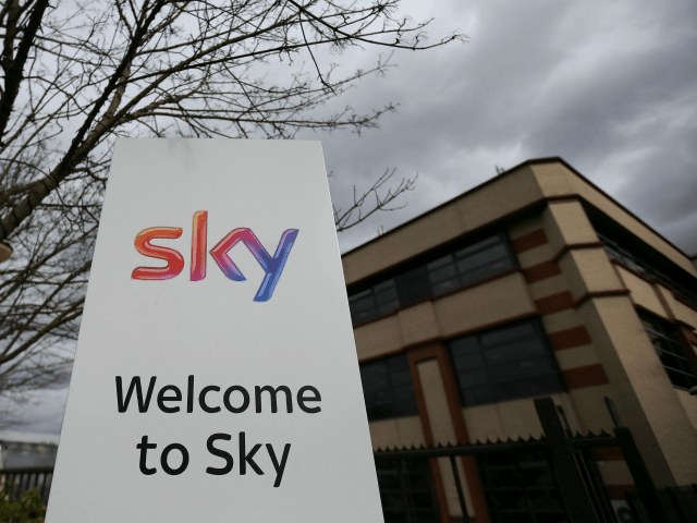 A Sky logo is pictured on a sign next to the entrance to pay-TV giant Sky Plc's headq