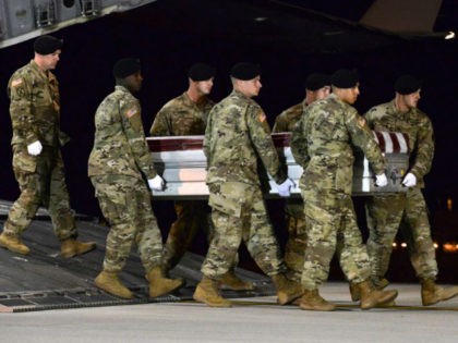 In this image provided by the U.S. Air Force, a U.S. Army carry team transfers the remains of Army Staff Sgt. Dustin Wright of Lyons, Georgia, Oct. 5, 2017, upon arrival at Dover Air Force Base, Delware. Wright, 29, was one of four U.S. troops and four Niger forces killed …
