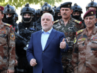 This file handout picture released by Iraqi Prime Minister Haider al-Abadi's office on July 9, 2016 shows him with army generals and members of the counter-terrorism forces in the capital Baghdad This file handout picture released by Iraqi Prime Minister Haider al-Abadi's office on July 9, 2016 shows him with army generals and members of the counter-terrorism forces in the capital Baghdad