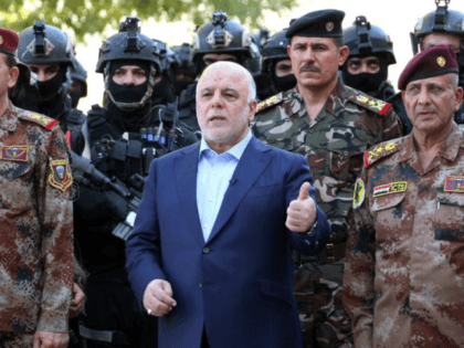 This file handout picture released by Iraqi Prime Minister Haider al-Abadi's office on July 9, 2016 shows him with army generals and members of the counter-terrorism forces in the capital Baghdad