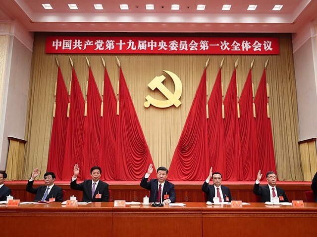 BEIJING, Oct. 25, 2017 -- Xi Jinping (C), Li Keqiang (3rd R), Li Zhanshu (3rd L), Wang Yang (2nd R), Wang Huning (2nd L), Zhao Leji (1st R) and Han Zheng (1st L) attend the first plenary session of the 19th Communist Party of China (CPC) Central Committee at the Great Hall of the People in Beijing, capital of China, Oct. 25, 2017. (Xinhua/Ju Peng via Getty Images)