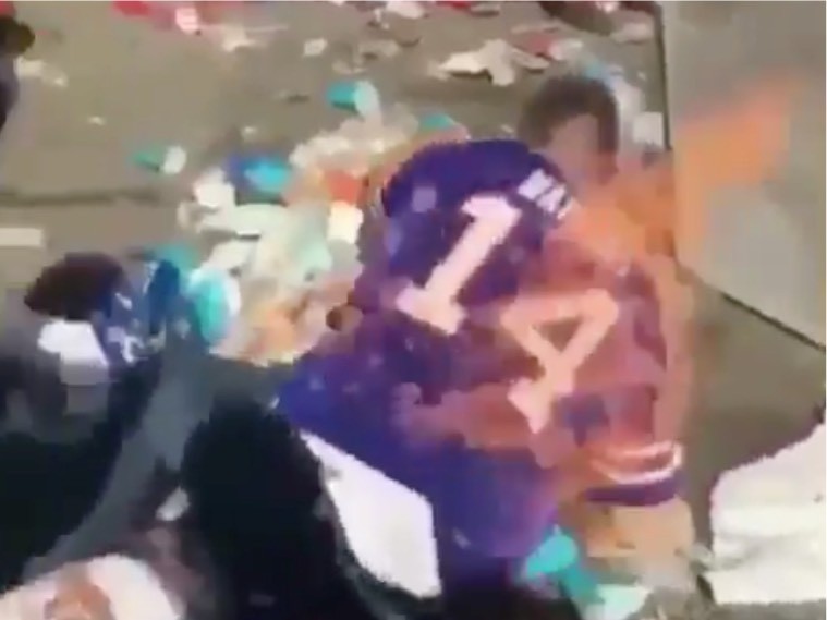Watch Bills Fan Jumps Onto Burning Table, Catches Fire