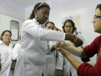 brazil Cuba is sending thousands of badly needed doctors to Brazil, but Brazil's medical establishment has sought to block the program. Here, Cuban Dr. Yocelin Macias treats a patient in the capital Brasilia on Aug. 30.