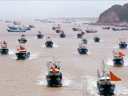 ZHOUSHAN, CHINA - AUGUST 01: Fishing boats set sail to East China Sea for fishing on August 1, 2017 in Zhoushan, Zhejiang Province of China. About 3575 fishing boats set off from Shenjiamen fishing harbor from 12 pm Tuesday in Zhoushan. They will sail to the East China Sea for …
