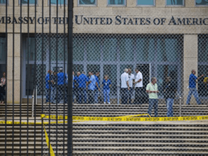 FILE - In a Friday, Sept. 29, 2017 file photo, staff stand within the United States embassy facility in Havana, Cuba. The terrifying attacks in Cuba overwhelmingly hit U.S. intelligence operatives in Havana, not ordinary diplomats, when they began within days of President Donald Trump’s election, The Associated Press has …