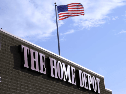 In this Wednesday, May 18, 2016, photo, an American flag flies over a Home Depot store loc