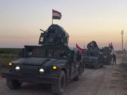 This image made from a video shows Iraqi soldiers on military vehicles in the Qatash area towards Kirkuk gas plant, south of Kirkuk, Iraq, Monday, Oct. 16, 2017. Iraqi state media say federal troops have entered disputed territories occupied by the nation's Kurds. The move comes three years after Kurdish …