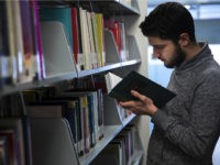 man-studying-library-istanbul-turkey-getty ISTANBUL, TURKEY - JANUARY 14: Amputee Syrian freelance cameraman Mohammad Kadour, who lost his leg after being shot by an Assad regime's soldier as he had been recording video for international TV channels, reads a book in library during an exclusive interview in Istanbul, Turkey on January 14, 2017. Currently, …