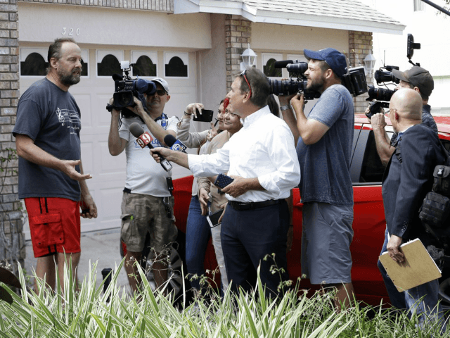 Eric Paddock, left, brother of Las Vegas gunman Stephen Paddock, speaks to members of the media outside his home, Monday, Oct. 2, 2017, in Orlando, Fla. Paddock told the Orlando Sentinel: "We are completely dumbfounded. We can't understand what happened." (AP Photo/John Raoux)
