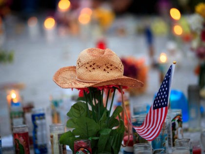 LAS VEGAS, NV - OCTOBER 8: A hat is left at a makeshift memorial during a vigil to mark one week since the mass shooting at the Route 91 Harvest country music festival, on the corner of Sahara Avenue and Las Vegas Boulevard at the north end of the Las …