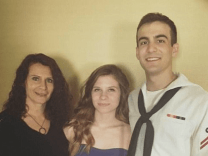 Navy sailor and his pregnant wife are shot in 'gang initiation' after being lured to an am