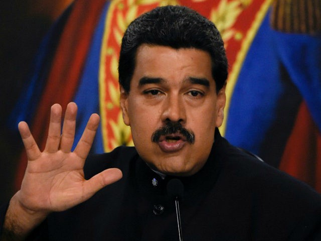 Venezuelan President Nicolas Maduro offers a press conference at the Miraflores presidential palace in Caracas on August 22, 2017. Chile said Tuesday it has granted diplomatic asylum to five Venezuelans who took refuge in its embassy in Caracas, amid political turmoil as Maduro moves to consolidate power. The five were …
