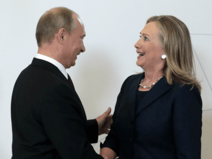 Russian President Vladimir Putin (L) welcomes US Secretary of State Hillary Clinton during