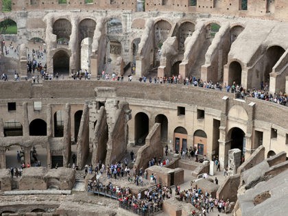 Tourists are seen visiting the ancient Colosseum as seen from the topmost floor on the occasion of a media tour presenting the re-opening after forty years of the fourth and fifth level of the Italy's most famous site, in Rome, Tuesday, Oct. 3, 2017. Italian Culture Minister Dario Francheschini was …