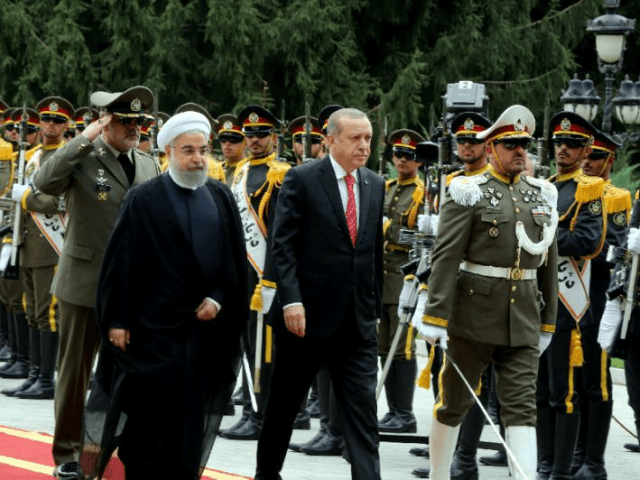 Iranian President Hassan Rouhani (L) welcomes Turkish counterpart Recep Tayyip Erdogan to