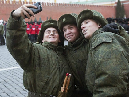 MOSCOW, RUSSIA - NOVEMBER 01: Russian soldiers take selfie before the rehearsal of the ceremonial march on Red Square, which will be held on November 7 dedicated to the 1941 parade in Moscow, Russia, on November 1, 2014. (Photo by Nikita Shvetsov/Anadolu Agency/Getty Images)