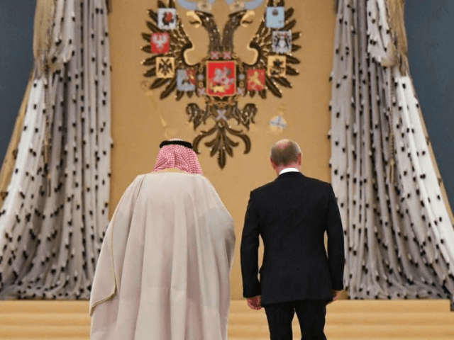 Russian President Vladimir Putin (R) and Saudi Arabia's King Salman bin Abdulaziz Al Saud