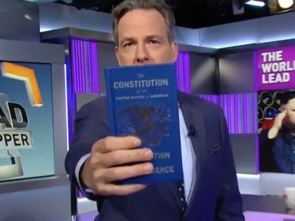 CNN's "The Lead" host Jake Tapper holds up a pocket U.S. Constitution in response to President Trump's media criticism.