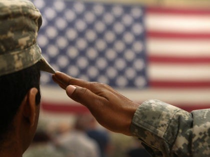 FORT CARSON, CO - JUNE 15: A soldier salutes the flag during a welcome home ceremony for troops arriving from Afghanistan on June 15, 2011 to Fort Carson, Colorado. More than 500 soldiers from the 1st Brigade Combat Team returned home following a year of heavy fighting and high casualties …