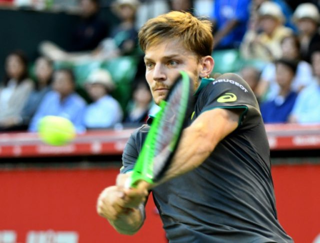 David Goffin of Belgium serves to Adrian Mannarino during the Japan Open final