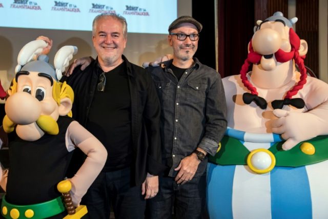 French cartoonist Didier Conrad (L), and writer and designer Jean-Yves Ferri pose with Ast