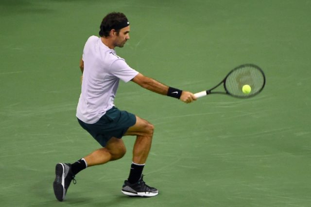 Roger Federer of Switzerland hits a return against Rafael Nadal of Spain during their men'