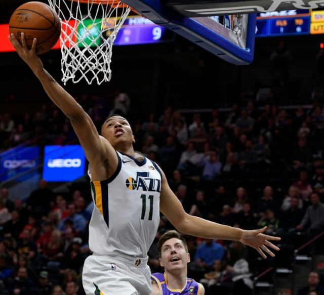 Dante Exum of the Utah Jazz scores in front of Dane Pineau of the Sydney Kings during thei