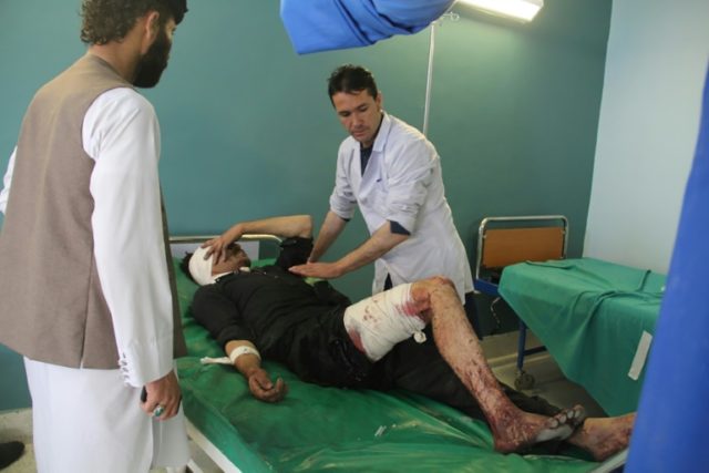 A wounded Afghan man receives treatment at a hospital after a suicide attack in Gardez, ca