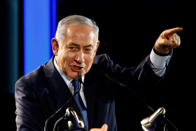 Israeli Prime Minister Benjamin Netanyahu delivers a speech during an event marking 50 yea