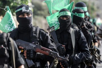 Fighters of the armed wing of Palestinian Islamist movement Hamas march in the southern Ga