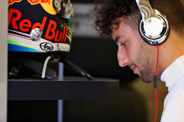 Daniel Ricciardo of Australia and Red Bull Racing prepares to drive in the garage before q